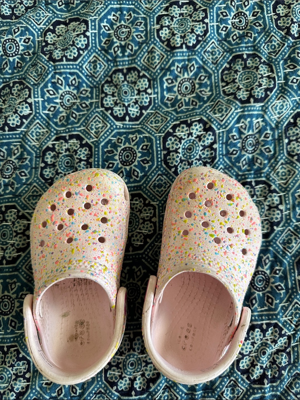 Girls crocs pink confetti.